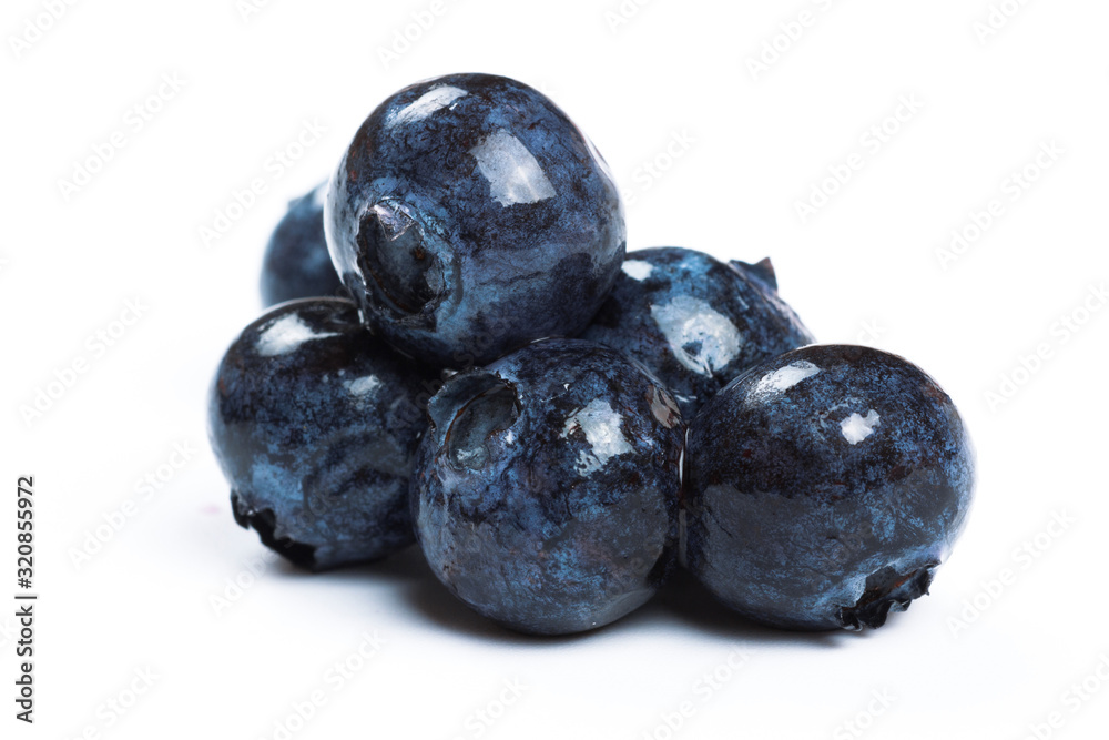 a handful of blueberries close-up isolated on white background