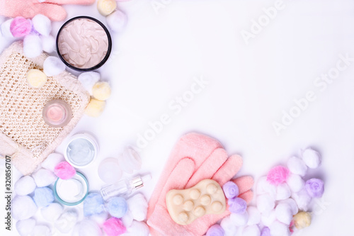 Cosmetic products and face and body care products. On a white background, top view. Copy space.