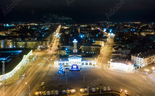 Night view of city center Kostroma with car traffic and illuminated Fire tower  Russia.