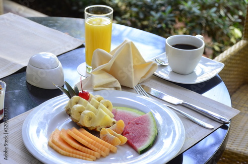 breakfast with fruit plate orange juice and coffee
