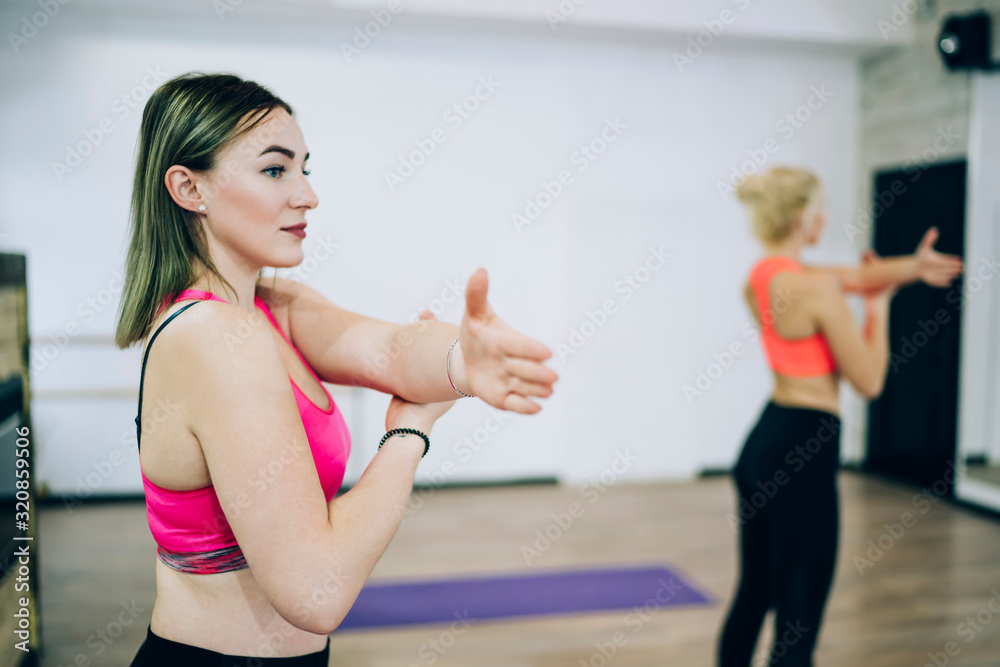 Attractive woman attending group fitness classes