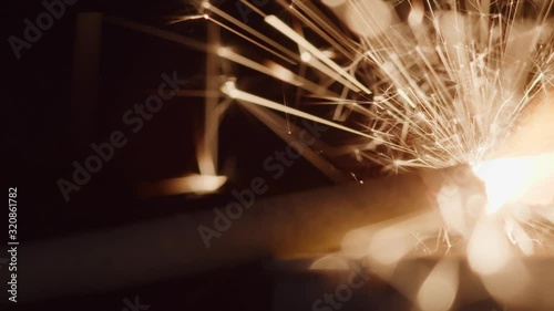 Dynamite fuse burns and sparks as it inches closer to the explosion - concept: mission impossible, difficult task, anticipation, stress, challenge, ignite, sudden idea, expectation