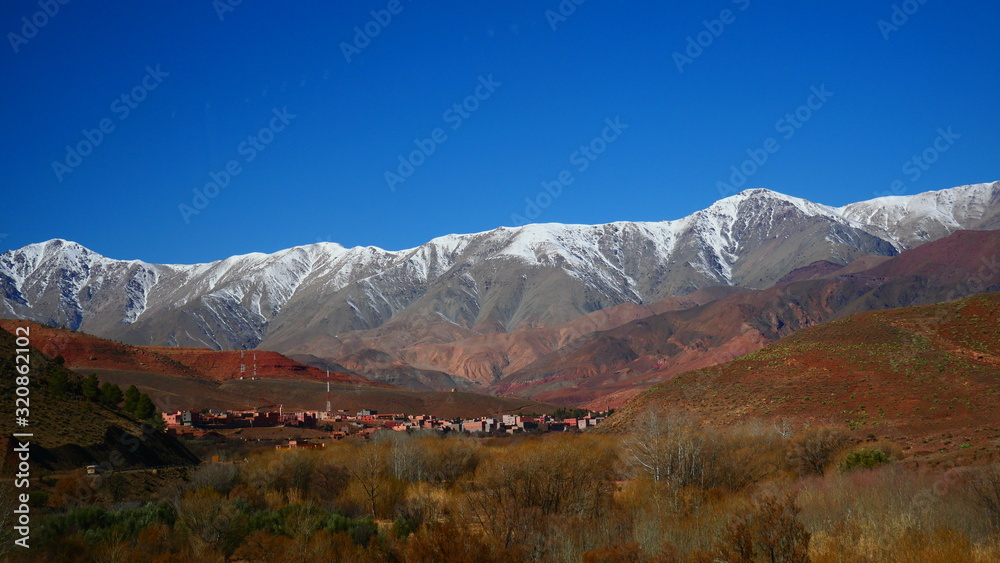 Bright landscape of Morocco, breathtaking curves of mountains, stunning combination of hills & farm land,inadvertent distribution of houses & huts, raw impression of pure nature. Bright landscape of Morocco, breathtaking curves of mountains, stunning combination of hills & farm land,inadvertent distribution of houses & huts, raw impression of pure nature.
