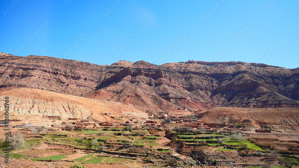 Bright landscape of Morocco, breathtaking curves of mountains, stunning combination of hills & farm land,inadvertent distribution of houses & huts, raw impression of pure nature. Bright landscape of Morocco, breathtaking curves of mountains, stunning combination of hills & farm land,inadvertent distribution of houses & huts, raw impression of pure nature.