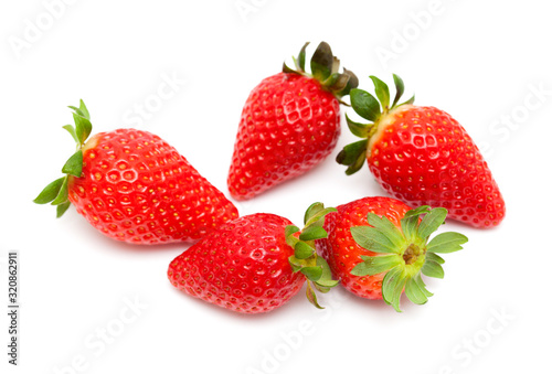 red ripe strawberries on white photo