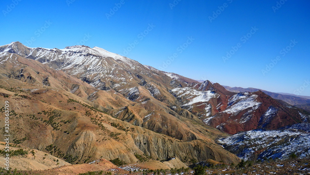 Bright landscape of Morocco, breathtaking curves of mountains, stunning combination of hills & farm land,inadvertent distribution of houses & huts, raw impression of pure nature. Bright landscape of Morocco, breathtaking curves of mountains, stunning combination of hills & farm land,inadvertent distribution of houses & huts, raw impression of pure nature.
