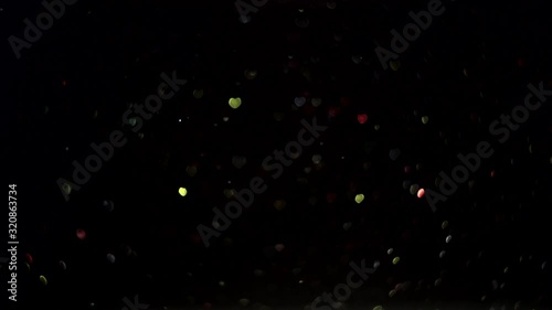 Valentine's day abstract background, particles and heart shape bokeh