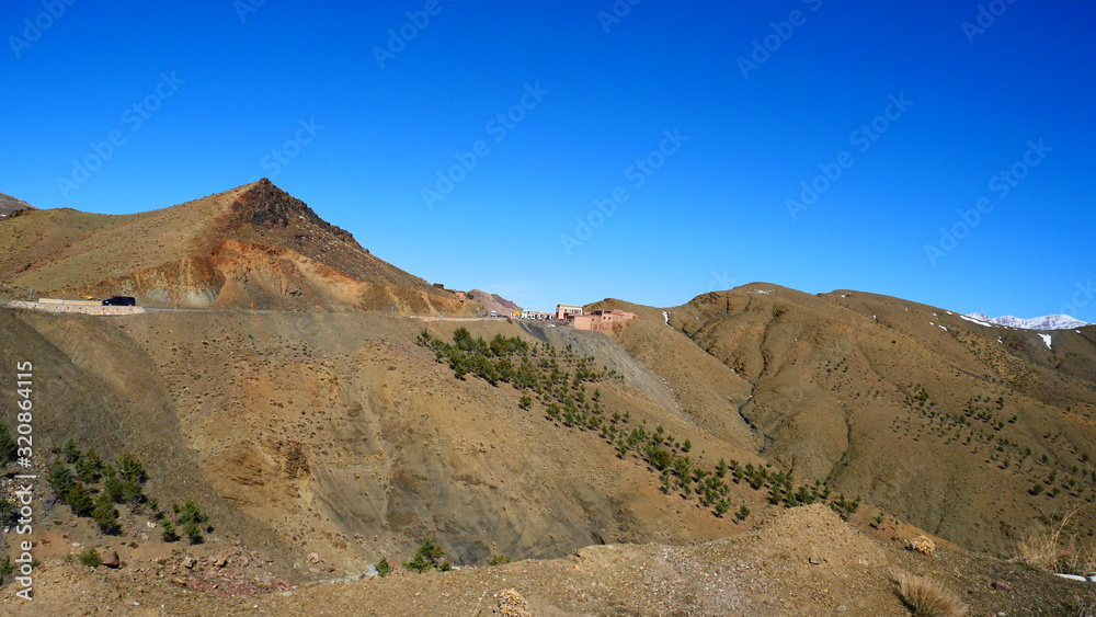 Bright landscape of Morocco, breathtaking curves of mountains, stunning combination of hills & farm land,inadvertent distribution of houses & huts, raw impression of pure nature. Bright landscape of Morocco, breathtaking curves of mountains, stunning combination of hills & farm land,inadvertent distribution of houses & huts, raw impression of pure nature.
