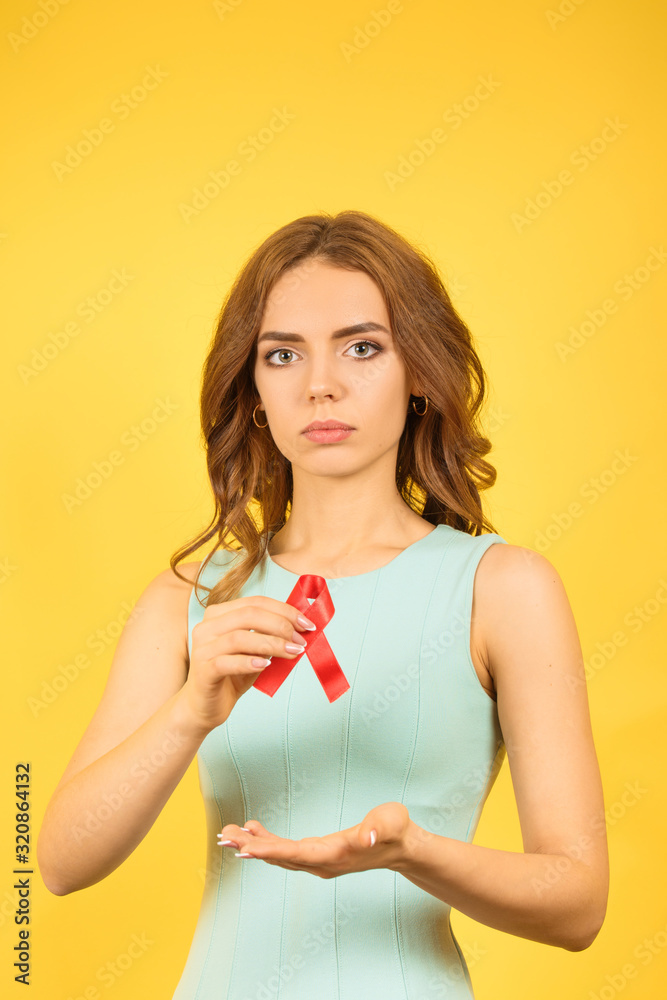 woman with red AID ribbon, vertical photo woman with red AID ribbon, vertical photo
