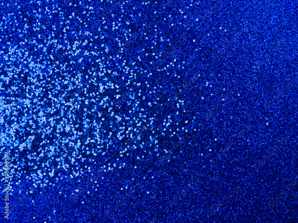 festive abstract glitter shiny blue background, holiday concept. Trendy color of the 2020 year
