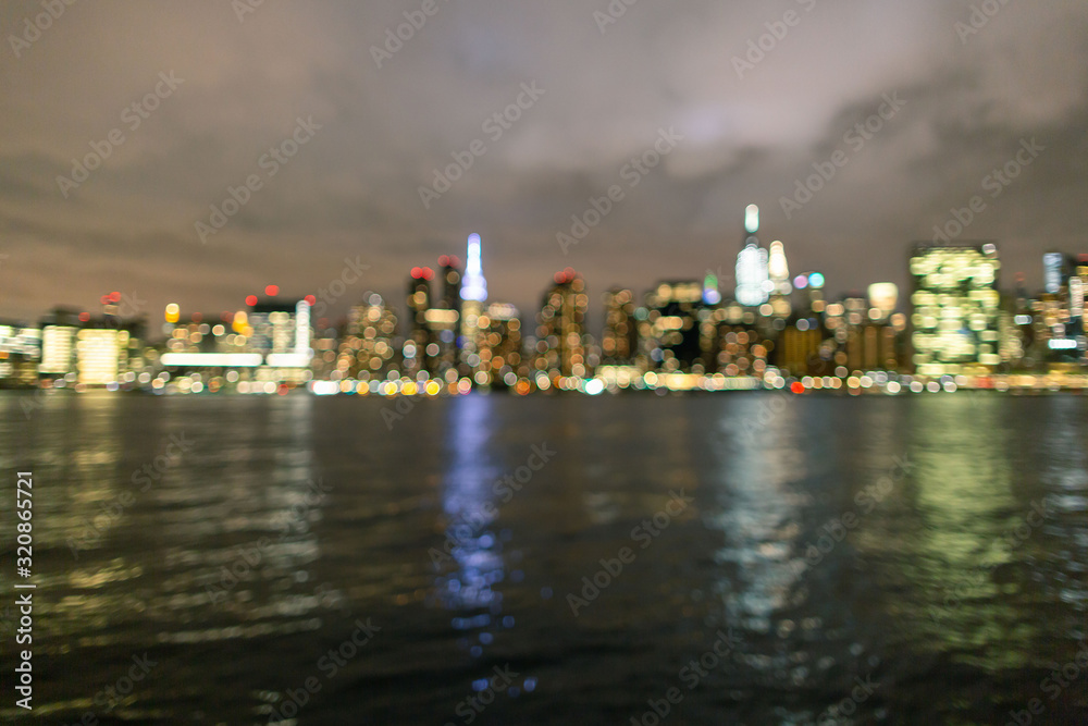 Blurred midtown Manhattan at night From East river
