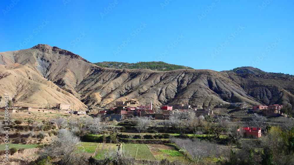 Bright landscape of Morocco, breathtaking curves of mountains, stunning combination of hills & farm land,inadvertent distribution of houses & huts, raw impression of pure nature. Bright landscape of Morocco, breathtaking curves of mountains, stunning combination of hills & farm land,inadvertent distribution of houses & huts, raw impression of pure nature.