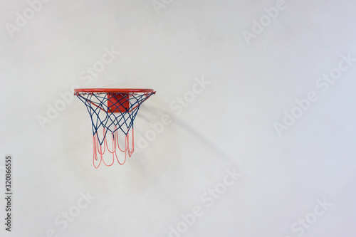 basketball hoop hanging on grunge wall in town street © Bonsales