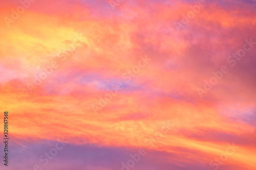 Red and yellow clouds in the sunset sky © onyx124