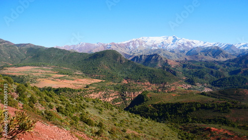 Bright landscape of Morocco, breathtaking curves of mountains, stunning combination of hills & farm land,inadvertent distribution of houses & huts, raw impression of pure nature.