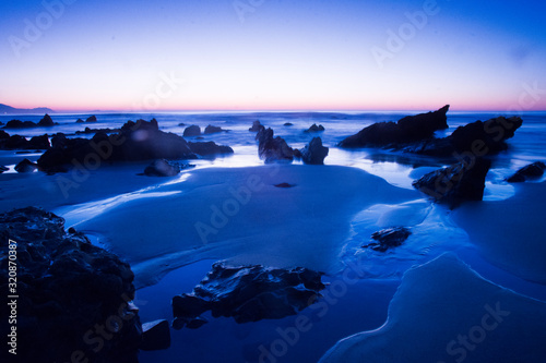 sunset on the beach in barrika, basque country