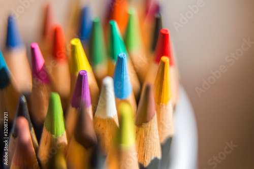Close up of color pencils on light background	