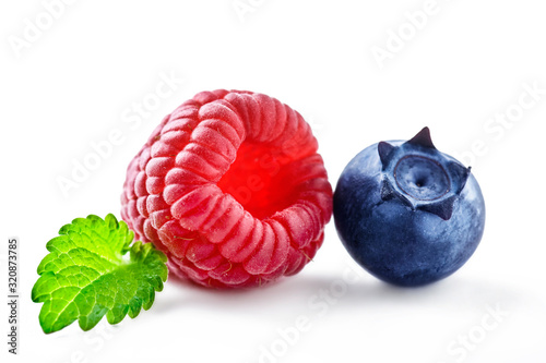 Raspberry and blueberry isolation. Forest fruits on white background.