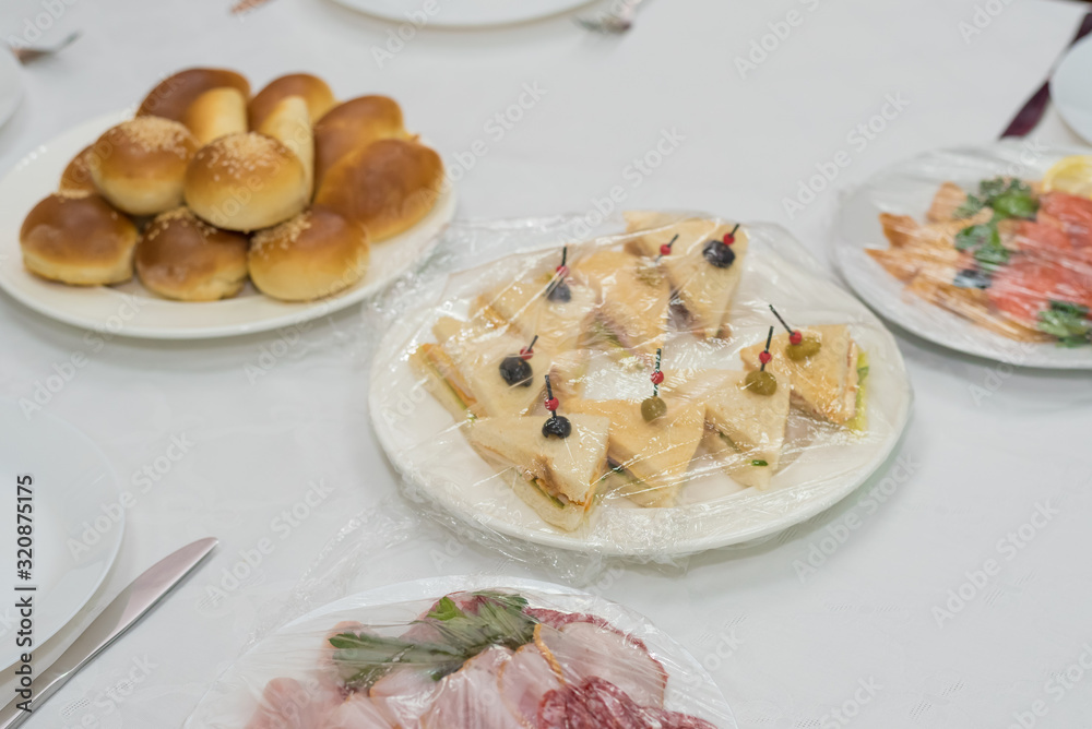 Catering for a banquet. Delivery of servings of food in packaging directly to the table. Catering for a banquet. Delivery of servings of food in packaging directly to the table.