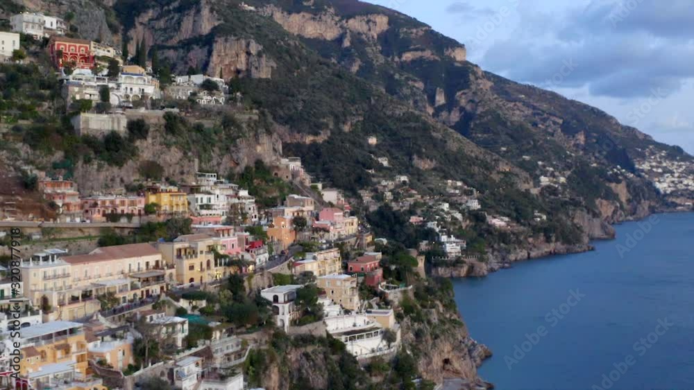 Aerial, tracking, drone shot overlooking buildings and Campania architecture, in the Positano village, on the Amalfi coast, in Salerno, southern Italy Aerial, tracking, drone shot overlooking buildings and Campania architecture, in the Positano village, on the Amalfi coast, in Salerno, southern Italy