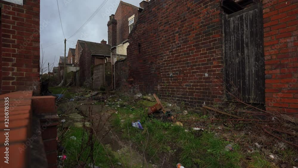 Back alley's of social housing in the poor area of Fenton, Stoke on Trent, one of West Midlands poverty stricken areas, rubbish dumped, over populated immigration hotspot Back alley's of social housing in the poor area of Fenton, Stoke on Trent, one of West Midlands poverty stricken areas, rubbish dumped, over populated immigration hotspot
