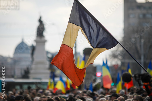 Details with the Romanian flag with a hole, the symbol of the Romanian Revolution from December 1989.