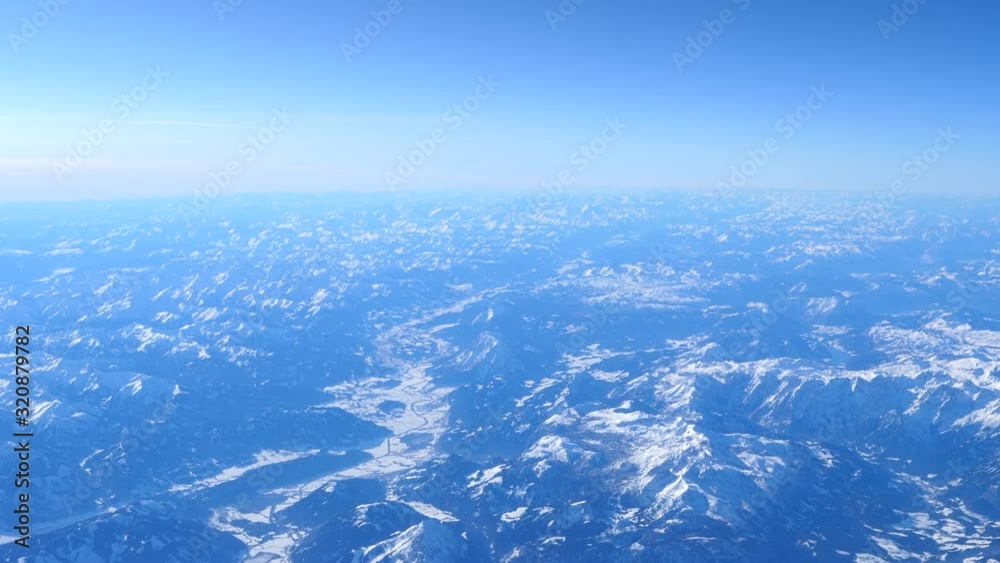 Snow capped Alps mountain ranges, establishing aerial slow motion Snow capped Alps mountain ranges, establishing aerial slow motion