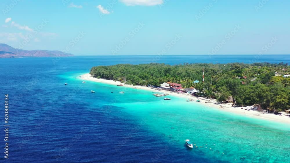 Beautiful island getaway with bright blue waters, white sand, and gorgeous greenery Beautiful island getaway with bright blue waters, white sand, and gorgeous greenery