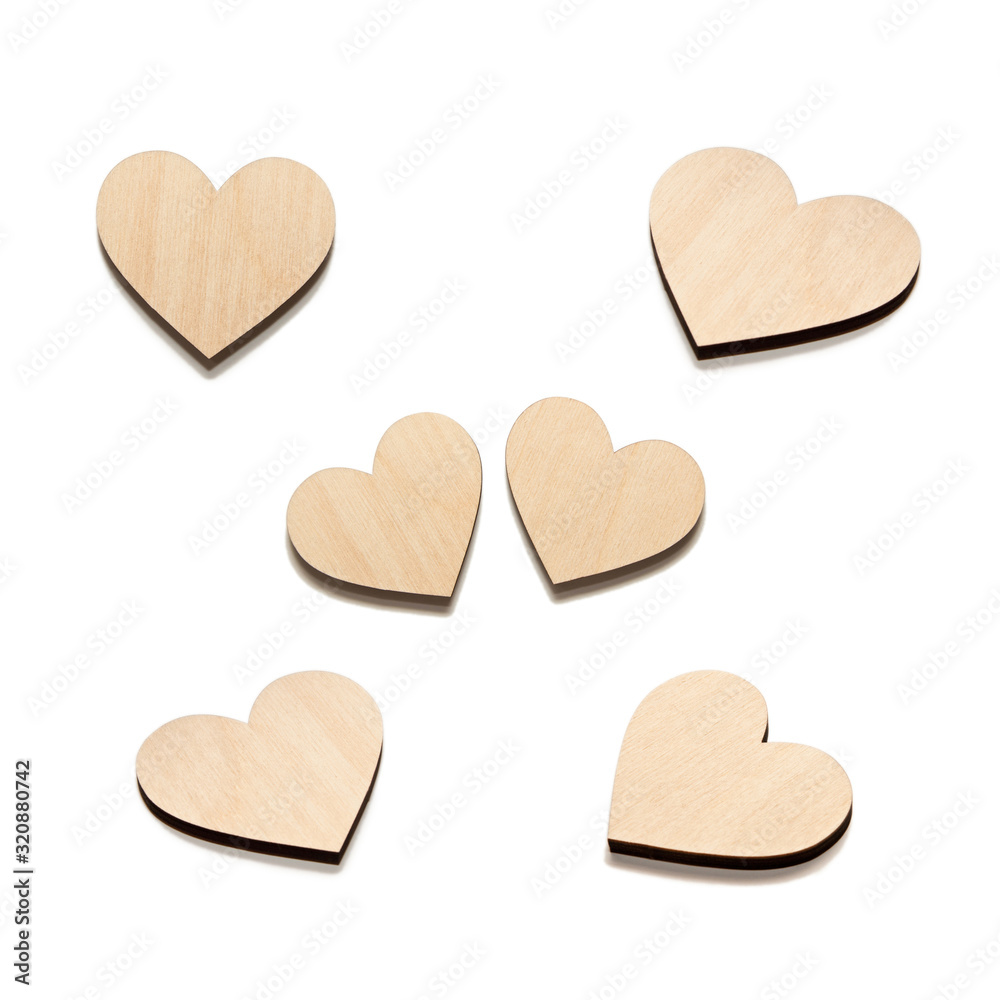 Obraz premium Six Wooden hearts on white