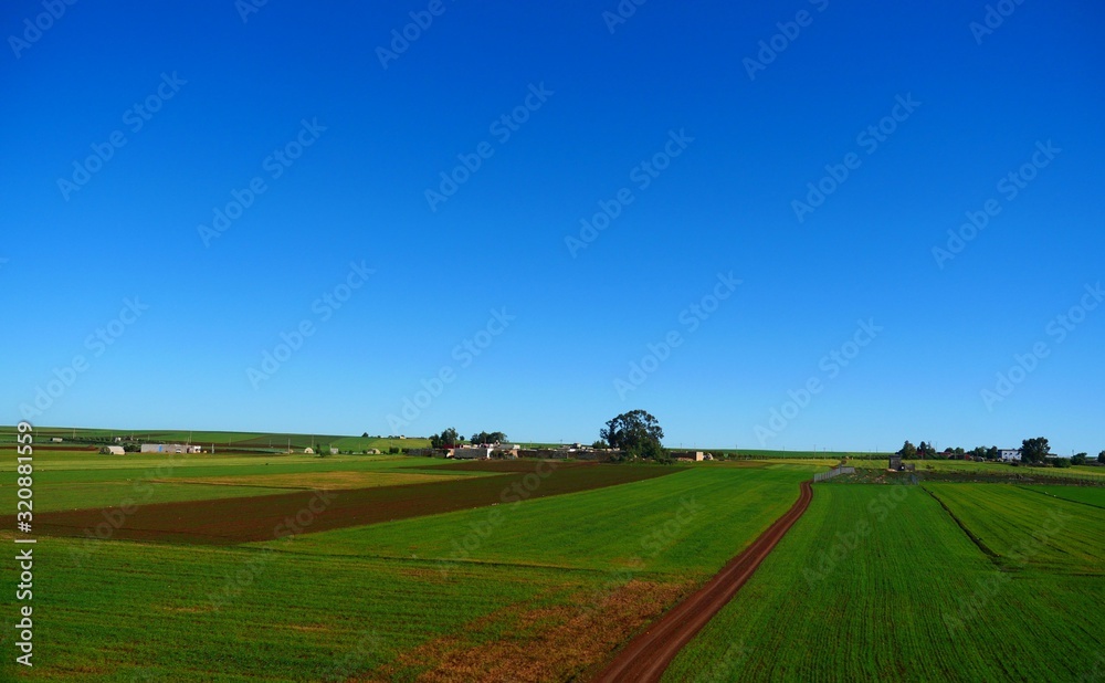 Bright landscape of Morocco, breathtaking curves of mountains, stunning combination of hills & farm land,inadvertent distribution of houses & huts, raw impression of pure nature.
