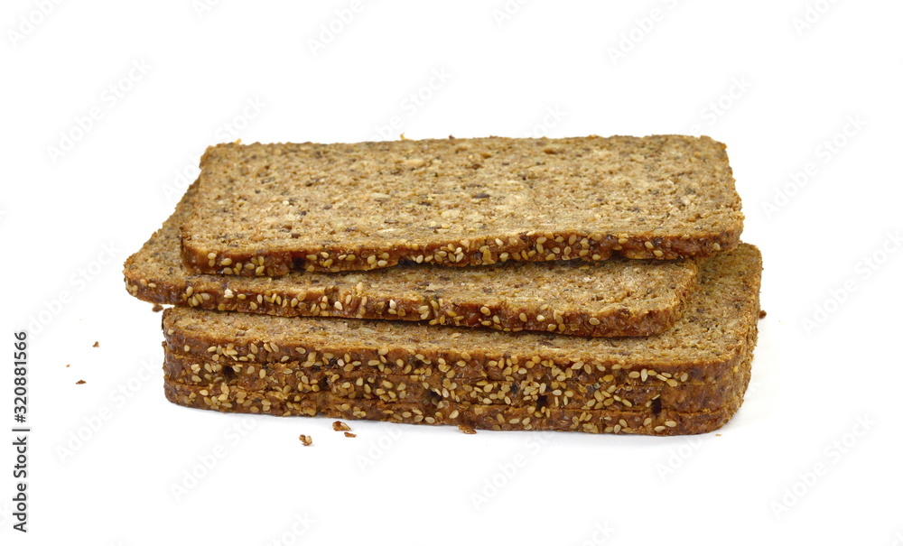 Slices of wholemeal dark bread isolated on a white background in close-up (high details) Slices of wholemeal dark bread isolated on a white background in close-up (high details)