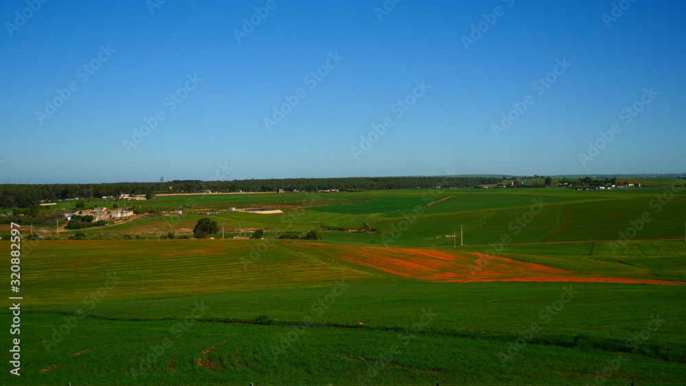 Bright landscape of Morocco, breathtaking curves of mountains, stunning combination of hills & farm land,inadvertent distribution of houses & huts, raw impression of pure nature. Bright landscape of Morocco, breathtaking curves of mountains, stunning combination of hills & farm land,inadvertent distribution of houses & huts, raw impression of pure nature.