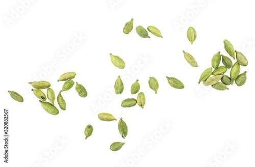 Dried green cardamom seeds isolated on a white background, top view.