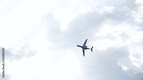 Big passenger plane in the blue sky. A general plan. Aerobatic figures. Airshow. 17 seconds