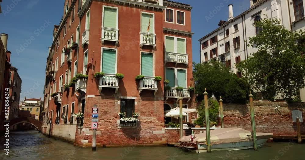 View down a narrow river channel in Venice Italy. View down a narrow river channel in Venice Italy.