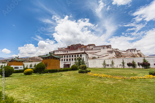 Stunning view of Potala Palace in summer sunny day, winter palace of Dalai Lama, blue sky and cloud in background, Lhasa (Lasa) of Tibet, China photo