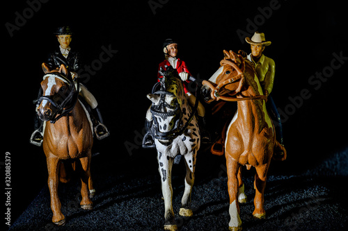 toy horse figurines in black background