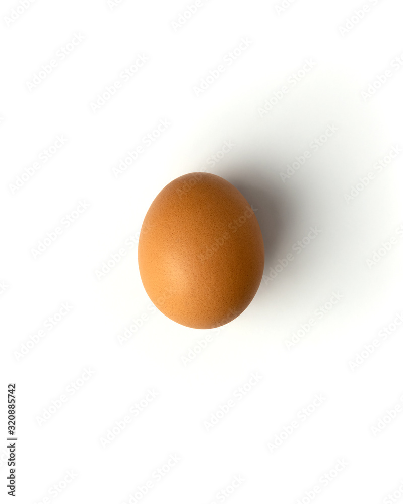 Brown chicken egg on a white background, flat lay, isolate Brown chicken egg on a white background, flat lay, isolate