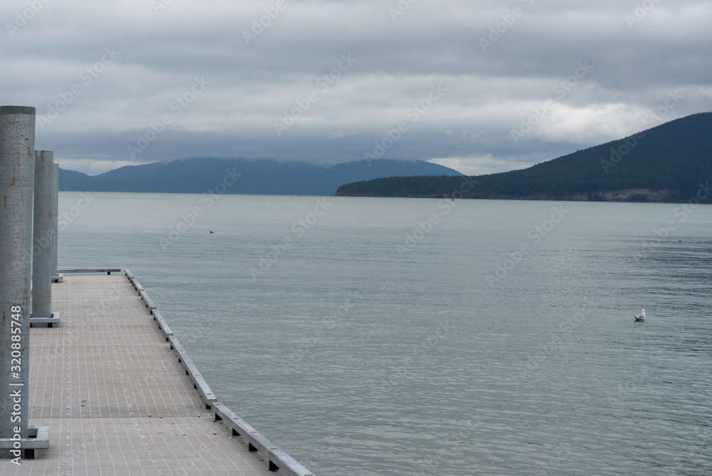 Landscape of metal pier on the sea with islands in the distance at Anacortes, Washington