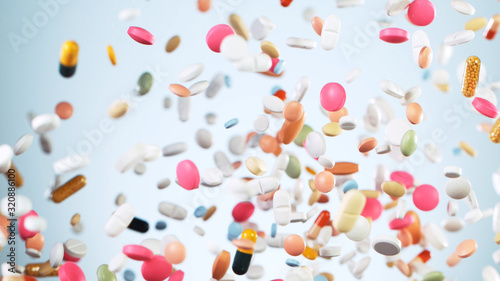 Konstfotografi Freeze motion of flying pills on white background
