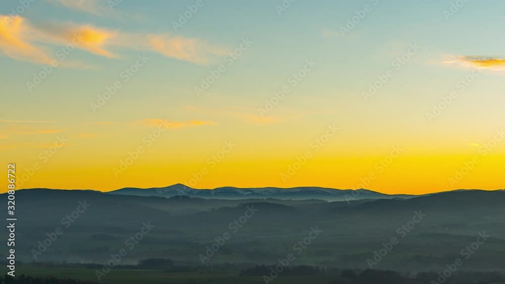 Time lapse of Snezka, Karkonosze mountains, during a foggy sunset Time lapse of Snezka, Karkonosze mountains, during a foggy sunset