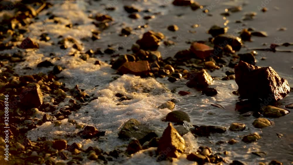 Ice buildup on a rocky lake shore in Poland - close up