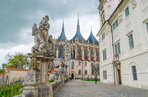 Saint Barbara s Cathedral Roman Catholic church Gothic style building and baroque statues in front of Jesuit College in Kutna Hora historical Town Centre  Central Bohemian Region  Czech Republic