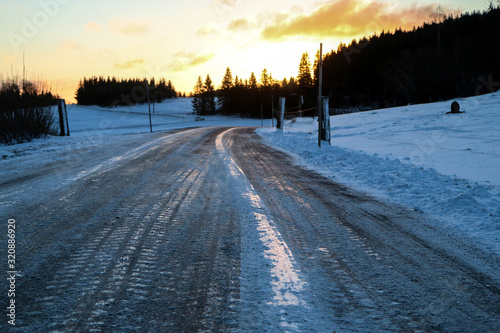 The picture illustrates the winter conditions on roads, when the ice, snow and frost is on the tarmac. 