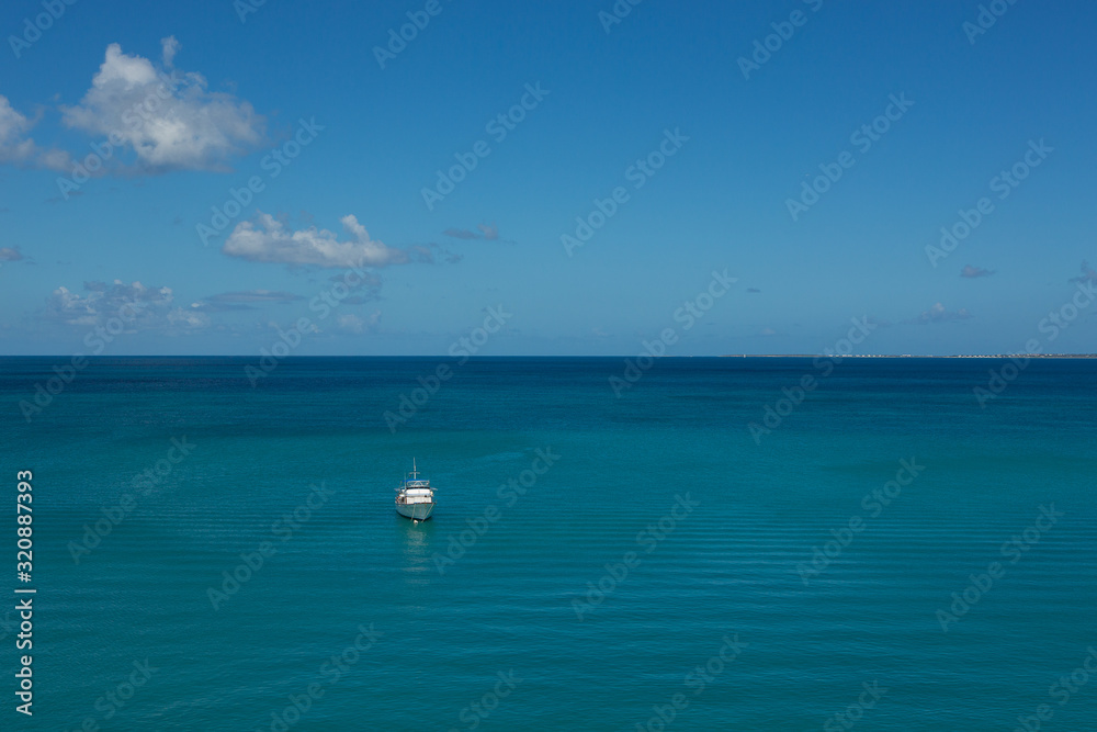 Fototapeta premium boat at sea with blue sky