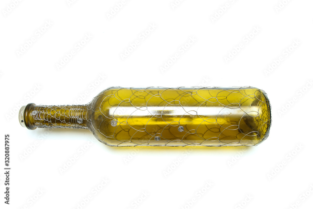 Fototapeta premium The wire brushed wine bottle. The traditional decorative craft. In a white background. 