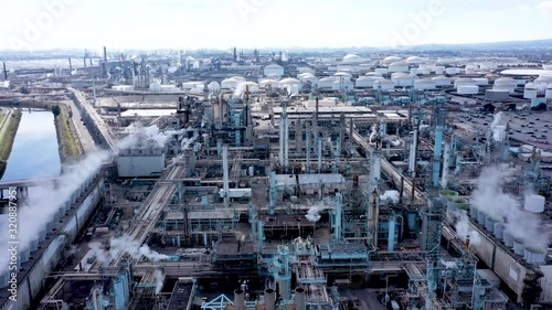 Aerial Drone Footage of Petroleum Refinery and Trucks in Industrial Area of the United States photo