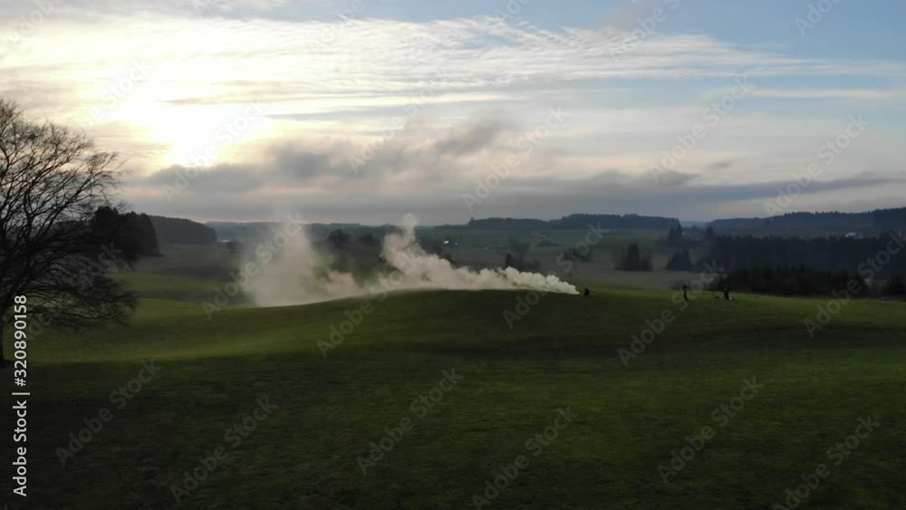 Drone flying over smoke on day with clouds Drone flying over smoke on day with clouds