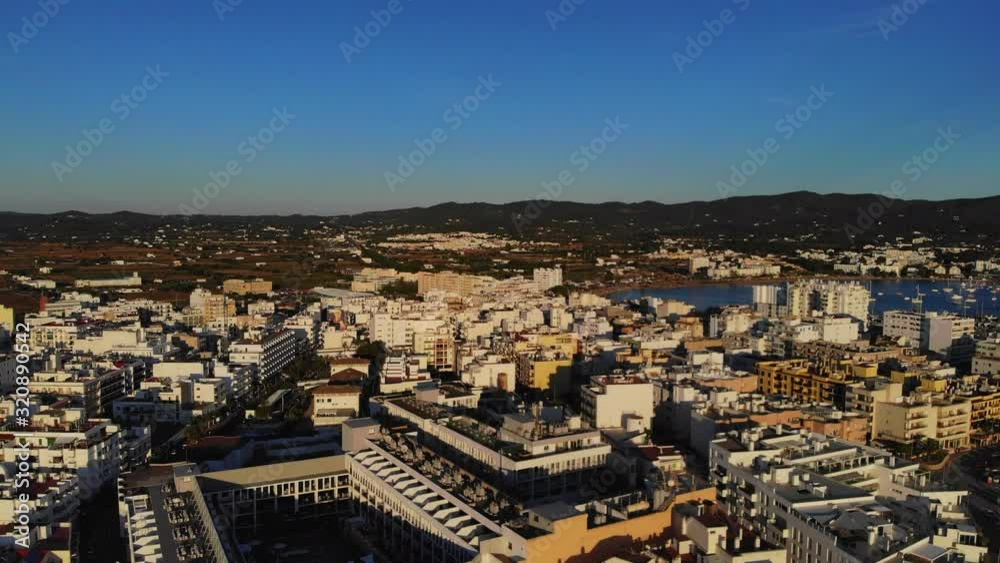 drone video of the city Sant Antoni de Portmany in ibiza overflying houses and hotels during golden hour drone video of the city Sant Antoni de Portmany in ibiza overflying houses and hotels during golden hour