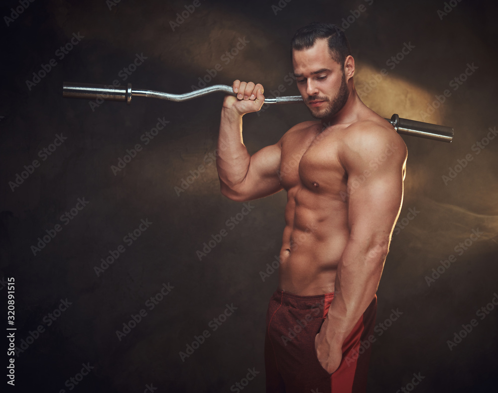 Handsome young man is posing for photographer with sports equipment. Handsome young man is posing for photographer with sports equipment.